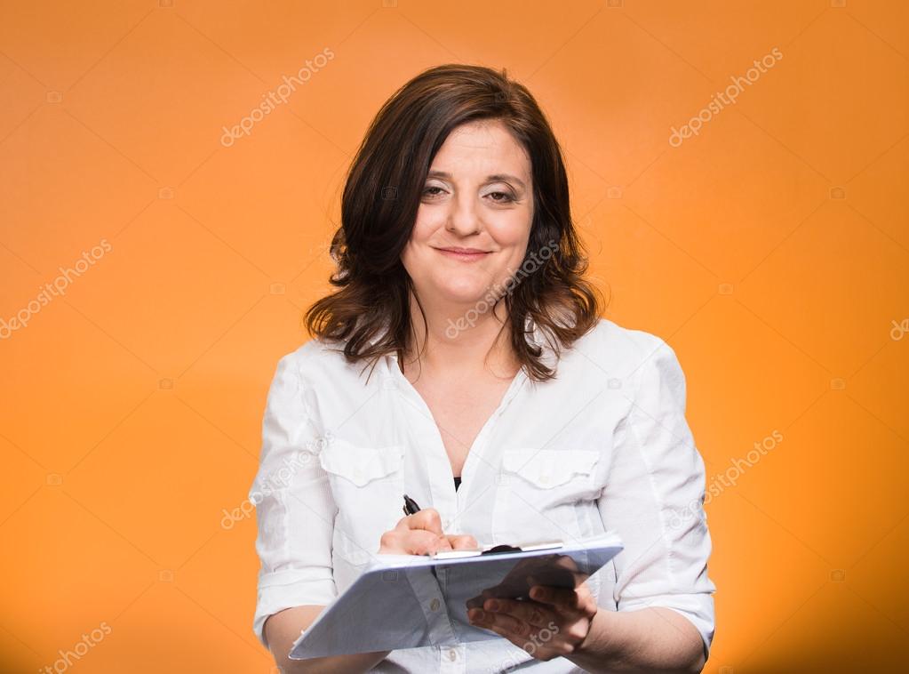 Mature business woman with clipboard