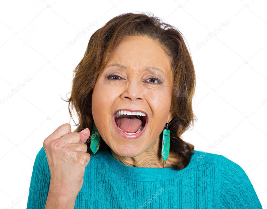 Angry, upset senior mature woman screaming