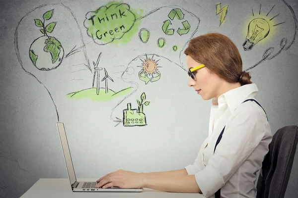 Woman working on computer solving ecology, renewable energy problem — Stock Photo, Image