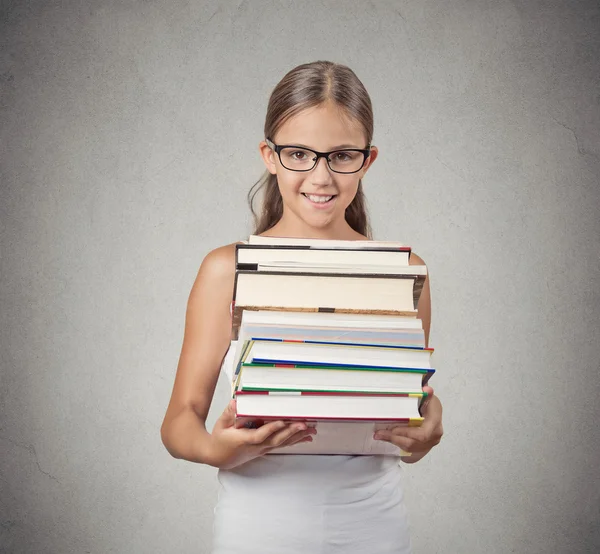 Teenager girl student holding pile of books — Stock Photo, Image