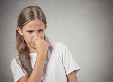 teenager girl pinches nose, something stinks clipart