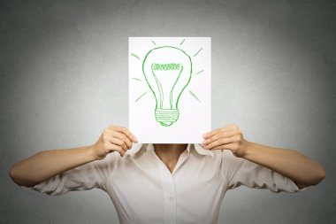 Businesswoman with green light bulb instead of head 