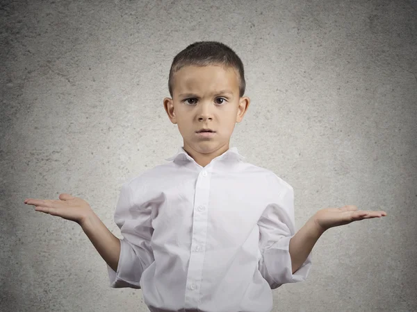 Clueless child boy with arms out asking what's problem — Stock Photo, Image