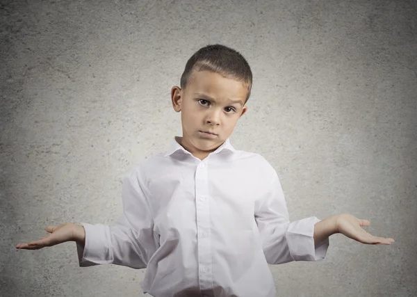 Clueless child boy with arms out asking what's problem — Stock Photo, Image