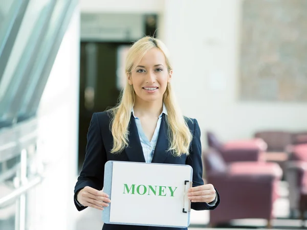 Business woman holding money sign — стоковое фото