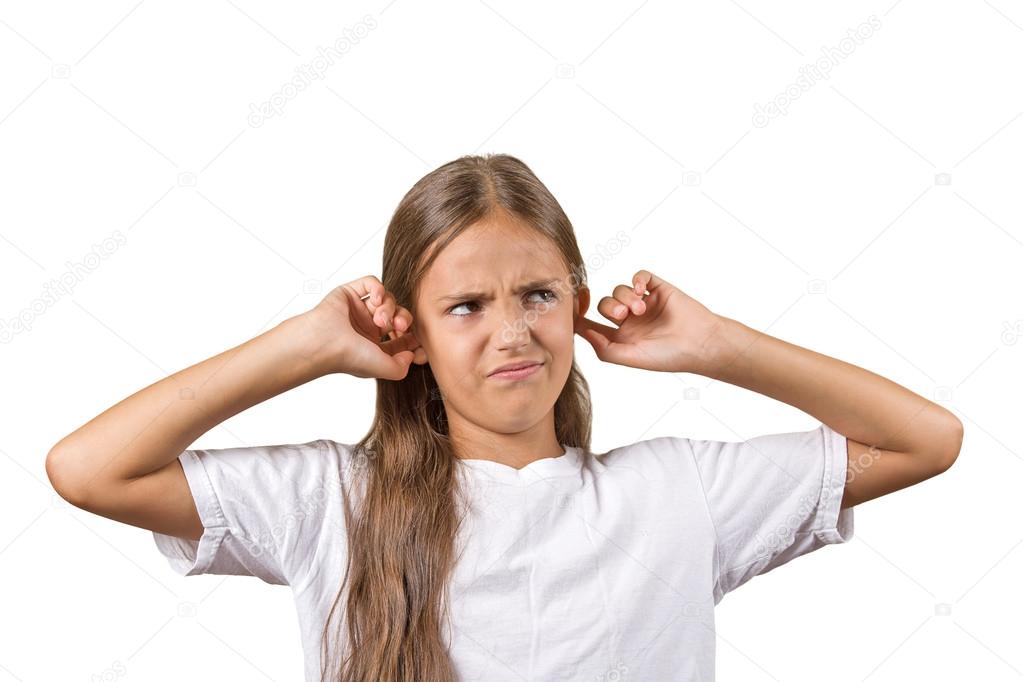 unhappy teenager girl covering her ears