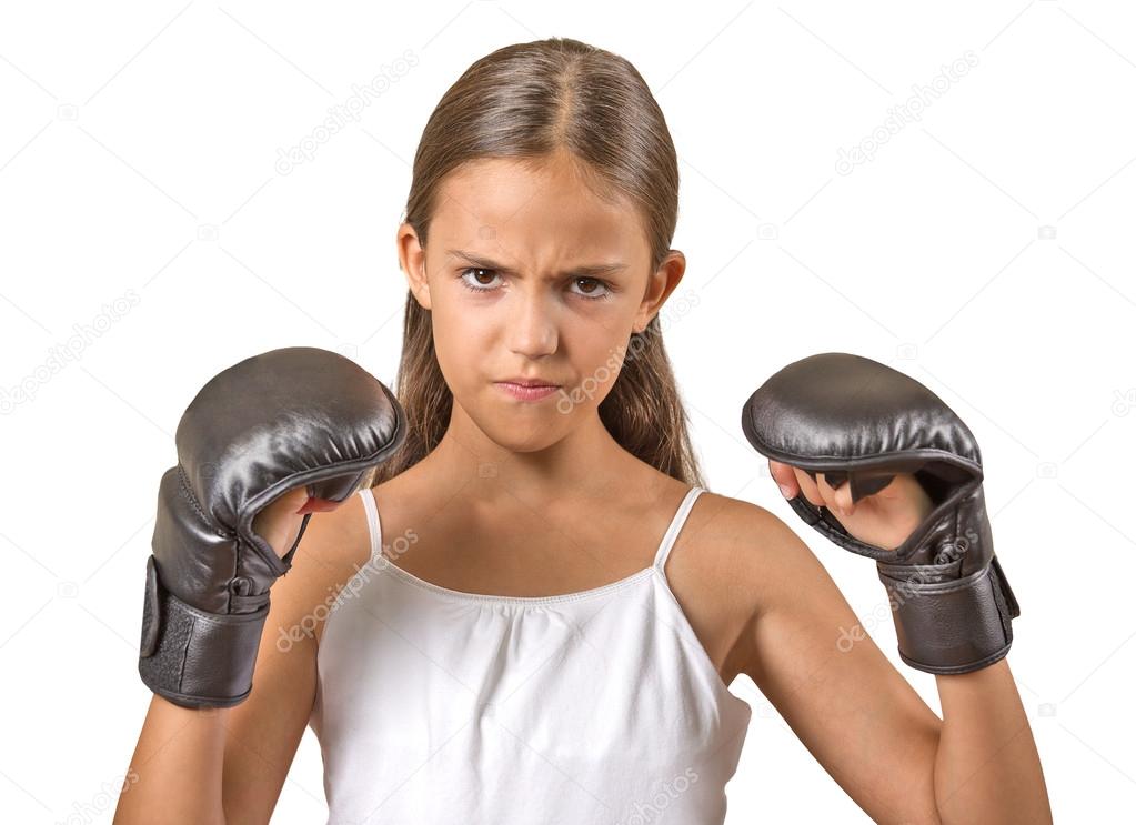 teenager girl wearing boxing gloves ready to figh