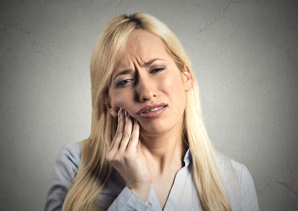 woman with sensitive tooth ache 