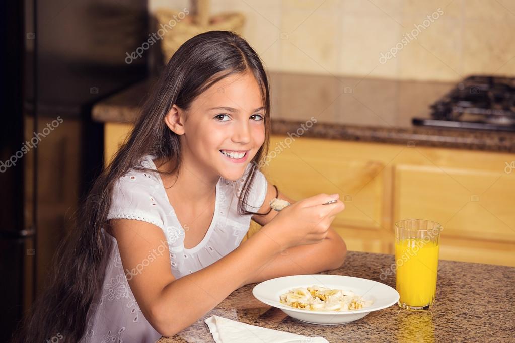 Girl eating cereal with milk — Stock Photo © SIphotography