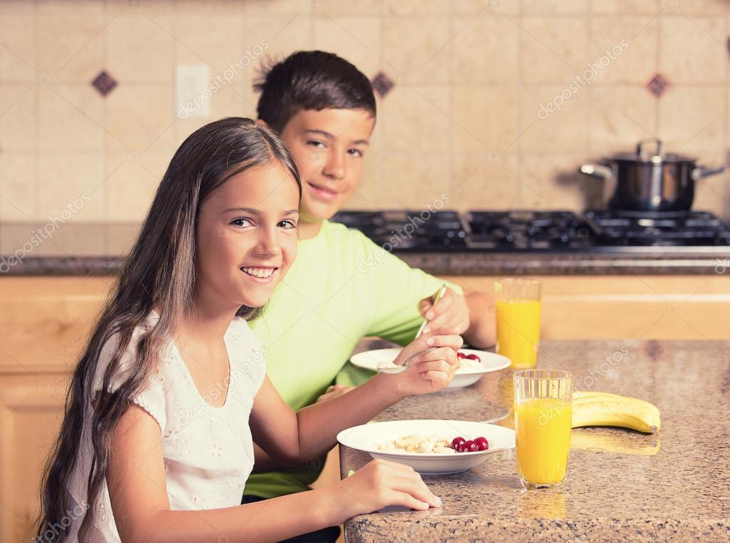 Children eating breakfast — Stock Photo © SIphotography #55012525