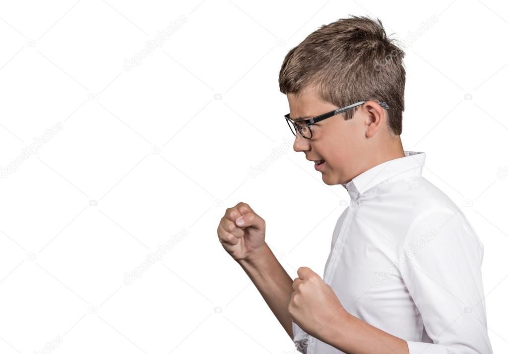 side portrait angry young man fists up in air