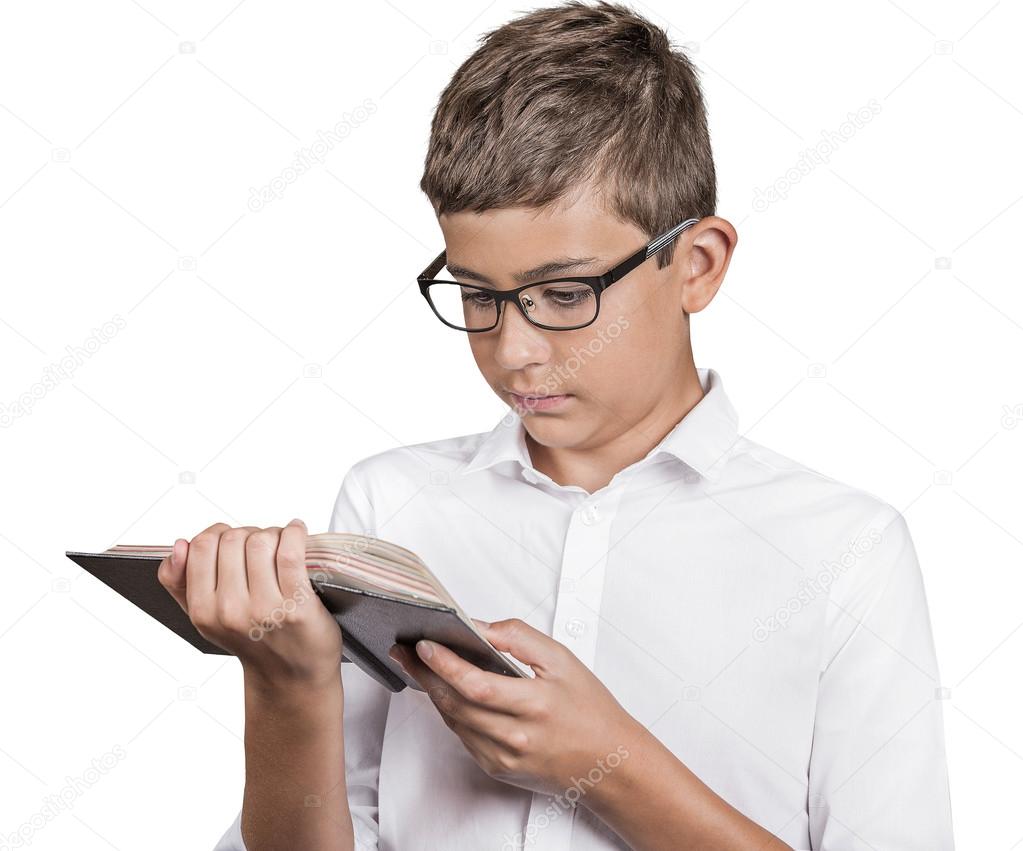 teenager with glasses reading book