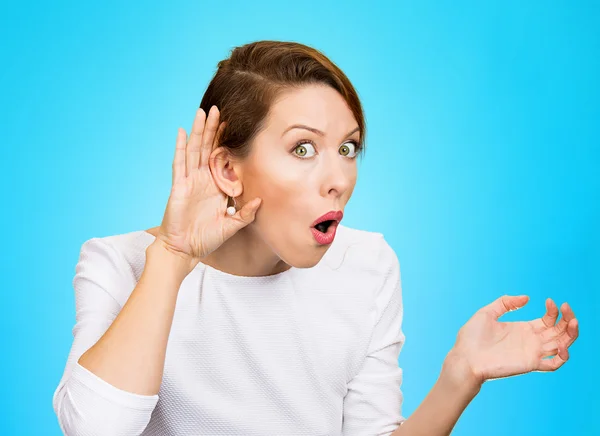 Nosy woman with hand to ear gesture — Stock Photo, Image