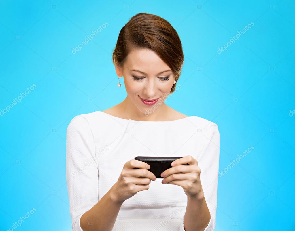 smiling woman texting on smartphone