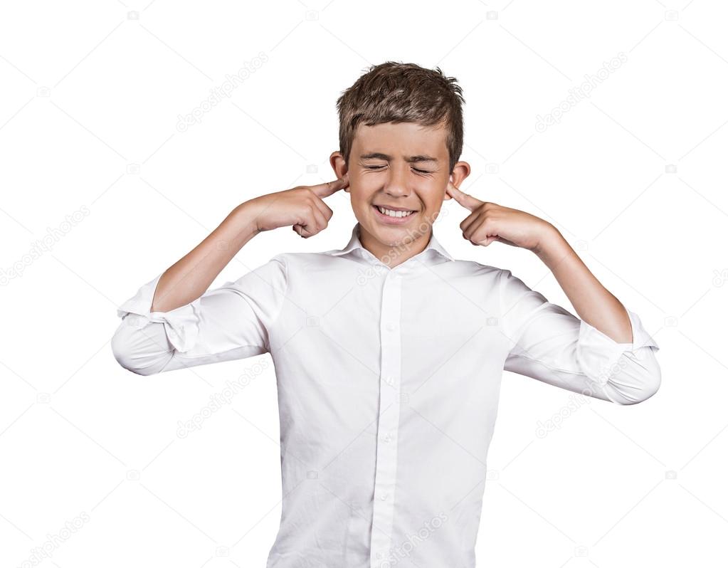 annoyed young man plugging closing ears