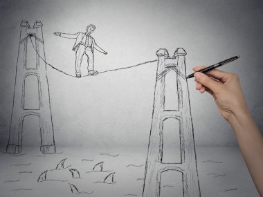bir ip üzerinde yürüyen işadamı