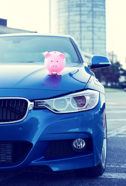 Car with piggy bank on hood