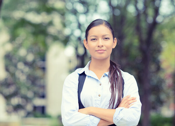 happy, young business woman smiling isolated outside background 