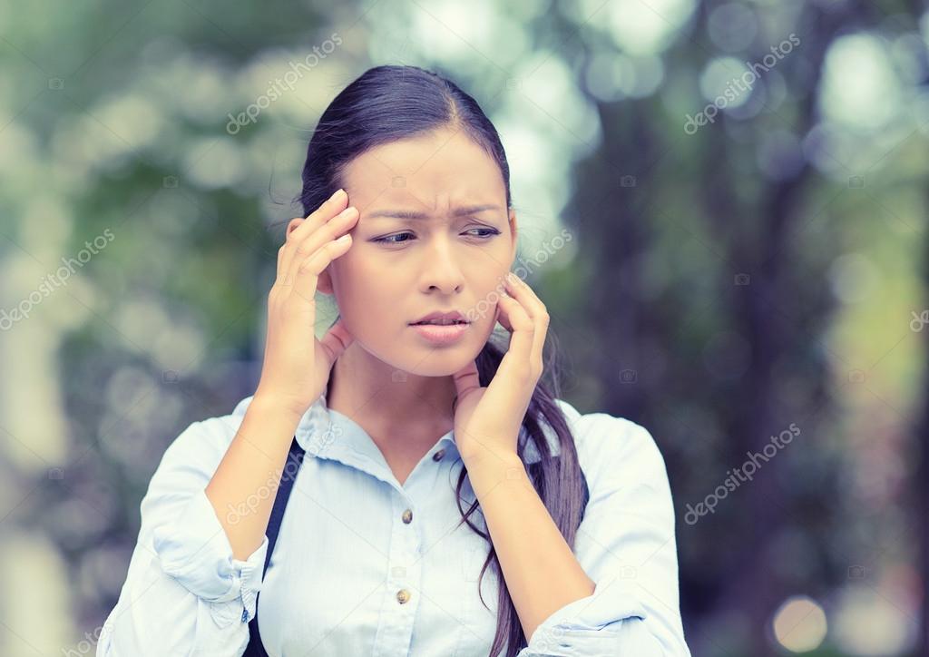 unhappy woman stressed having headache isolated outside background 