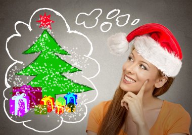 Noel ağacı seyir kırmızı santa yardımcı şapkalı kadın 