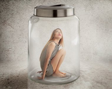 Young lonely woman sitting in glass jar clipart