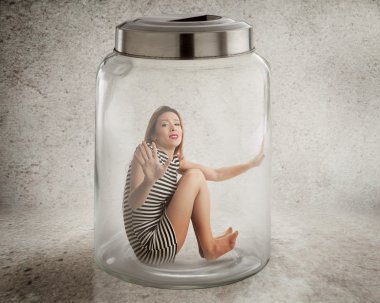 Young lonely woman sitting in glass jar clipart