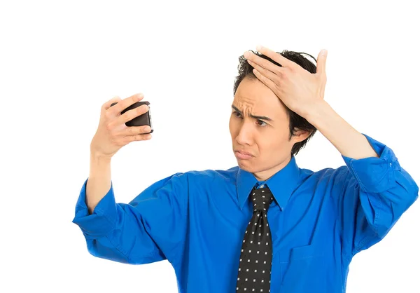 Man looking in mirror feeling head surprised shocked he is losing hair — Stock Photo, Image