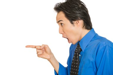 young shocked man pointing index finger at something stunned  clipart