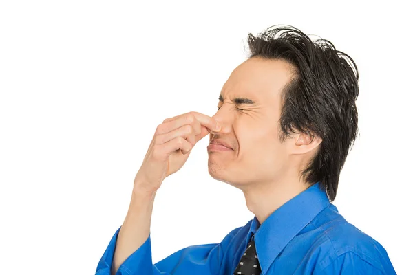 Man disgust on his face pinches his nose, something stinks bad smell — Stock Photo, Image