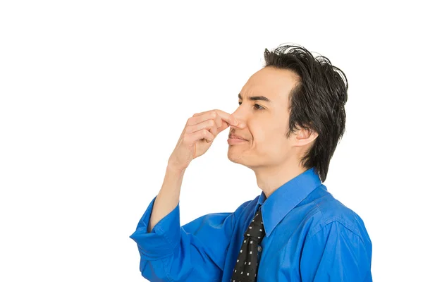 Man disgust on his face pinches his nose, something stinks bad smell — Stock Photo, Image