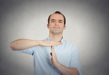 erious confident business man showing time out gesture  clipart