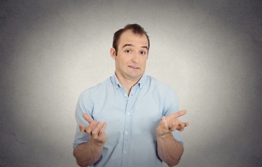 clueless funny looking young man arms out asking what do I do now clipart