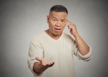 angry frustrated man gesturing asking are you crazy? clipart