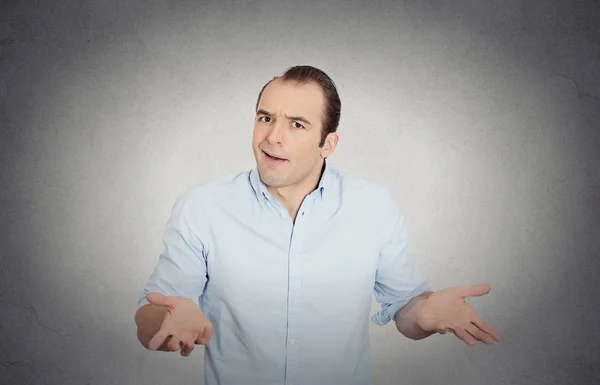 Clueless funny looking young man, arms out asking what's the problem — Stock Photo, Image