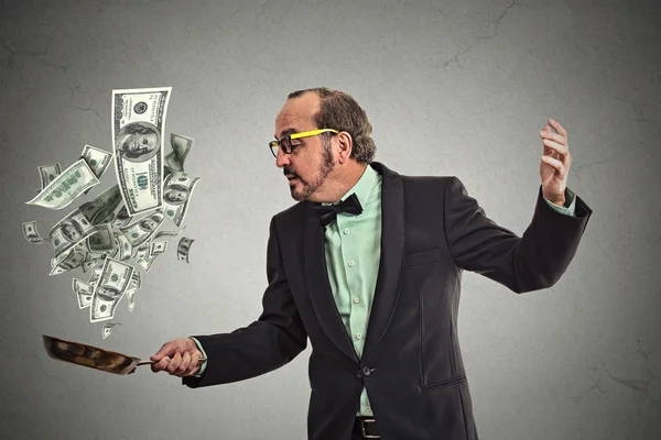 Middle age businessman juggling money dollar bills — Stock Photo, Image