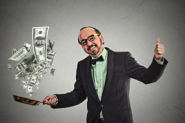 Middle age businessman juggling money dollar bills — Stock Photo, Image