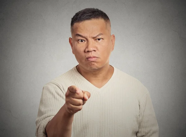 Angry man pointing his finger at somebody — Stock Photo, Image