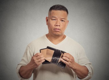 Sad man holding empty wallet clipart