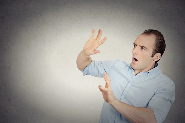 Man looking shocked scared trying to protect himself — Stock Photo, Image