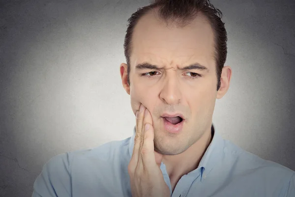 Headshot young man with sensitive tooth ache crown problem — Stock Photo, Image