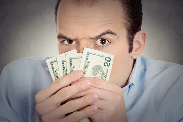 Greedy banker executive CEO boss, holding dollar banknotes Royalty Free Stock Images