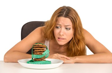 woman craving sugar sweet cookies but worried about weight gain clipart