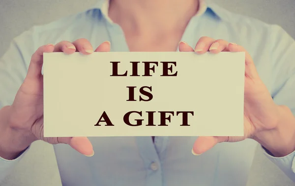 Woman hands holding white card with life is a gift message — Stock Photo, Image