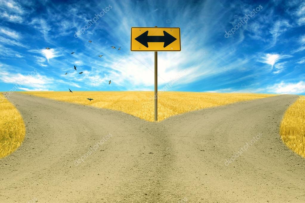 Two roads, road sign ahead with arrows blue sky background Stock Photo by  ©SIphotography 63614551
