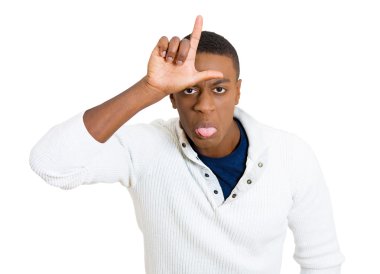 funny young man showing loser sign on his forehead clipart