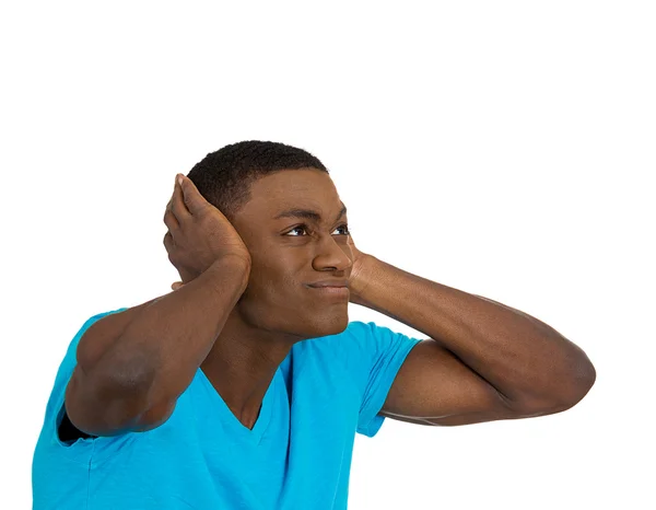 Unhappy stressed man covering his ears looking up — Stock Photo, Image