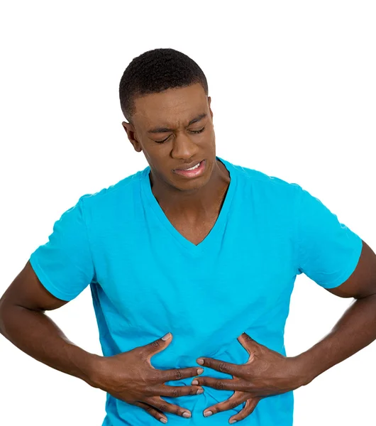 Upset, ill, unhealthy, young man, doubling over in stomach pain — Stock Photo, Image