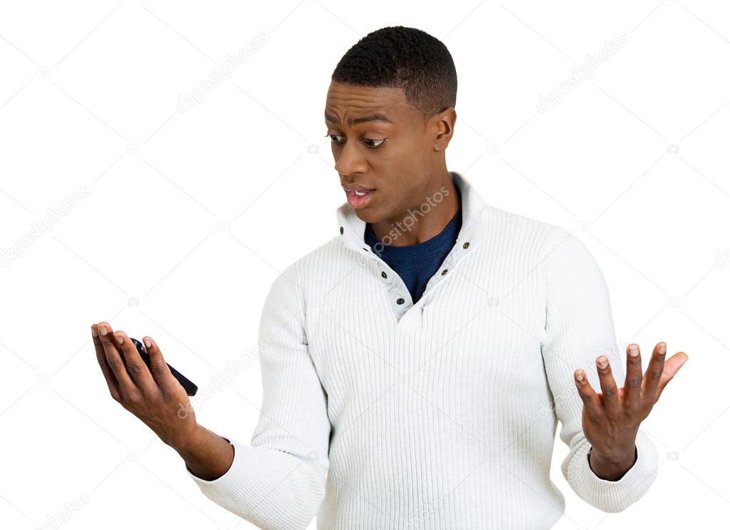 young man, shocked surprised by what he sees on his cell phone