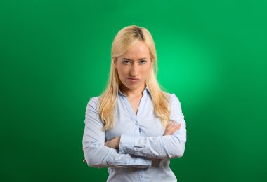 portrait angry blonde woman on grey background clipart