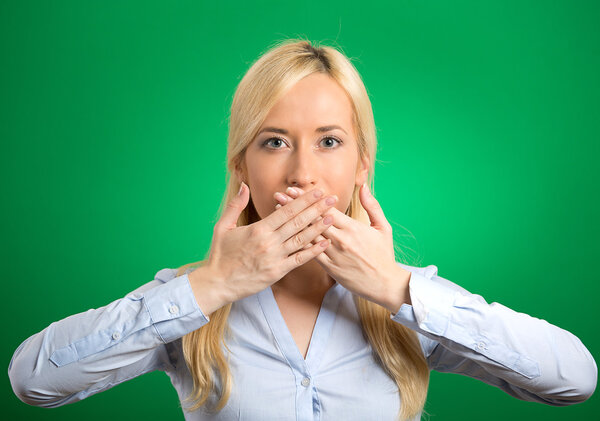 woman covering closed mouth with hands